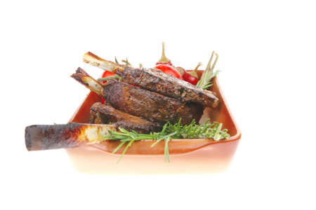 savory : roasted beef ribs with raw cherry tomatoes and fresh chivesの写真素材