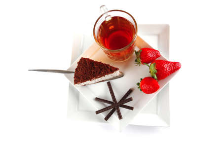 black tea and cake served with strawberryの写真素材