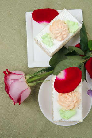 sweet breakfast : whipped cream cake with roses and hot black coffeeの写真素材