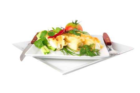 cannelloni in yellow cheese served with greenery on white dish