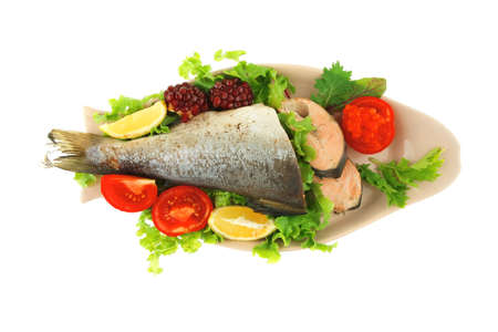 baked pink salmon served on plate with saladの写真素材