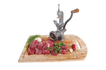 fresh uncooked beef meat slices over wooden cutting board ready to prepare with green hot and red...