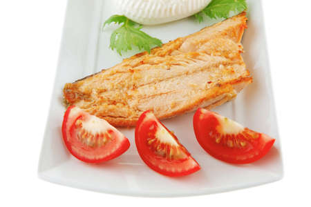 soft cheese and grilled salmon steak on white