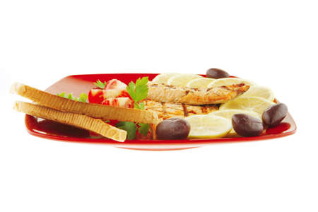 roast red salmon with lemon and tomatoesの写真素材