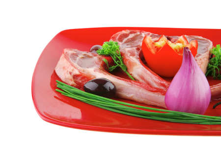 image of uncooked ribs served on redの写真素材