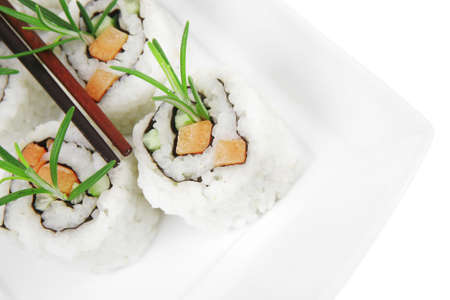 Japanese Cuisine - California Sushi Roll with Avocado, Cream Cheese and Raw Salmon inside. With wasabi and ginger. isolated over white backgroundの写真素材