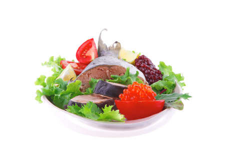 baked pink salmon served on plate with saladの写真素材