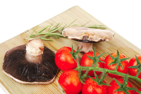 fresh raw vegetables served on wooden boardの写真素材