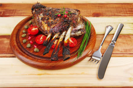 ready to eat grilled ribs on wooden plateの写真素材