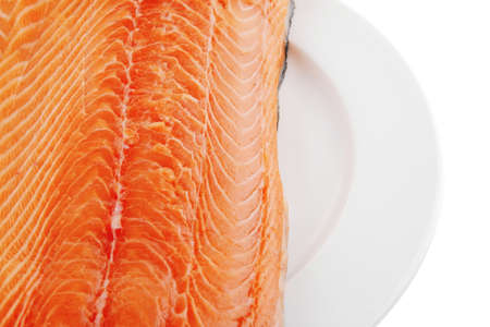 raw big salmon bar on white plateの写真素材