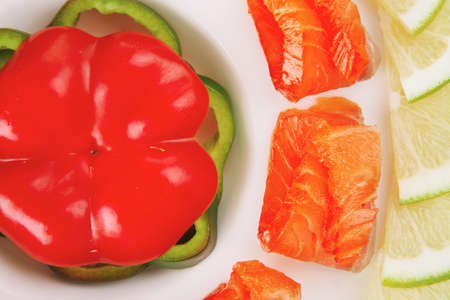 salmon with olives on white round plateの写真素材