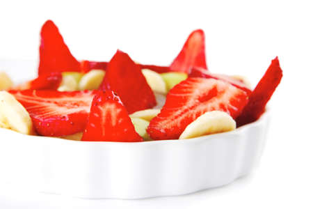 served fresh raw strawberries with slices on whiteの写真素材