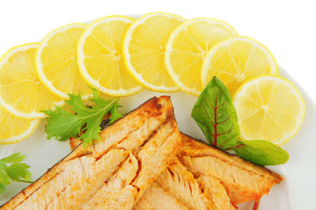 image of grilled salmon with vegetables on whiteの写真素材