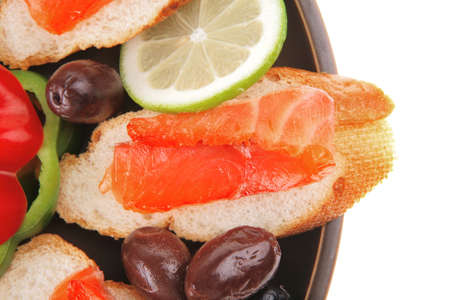 fresh vegetables with salmon on dark dishの写真素材