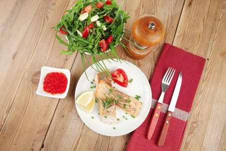 savory fish portion : roasted norwegian salmon chunks with  lemon and vegetable salad , rosemary...