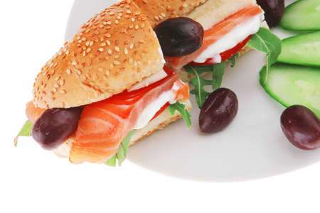 salmon sandwich and olives on green dishの写真素材