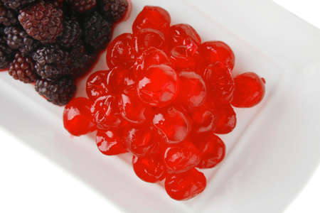 wild berry and cherry on white plateの写真素材