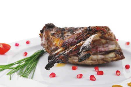served grilled ribs rack over white plateの写真素材