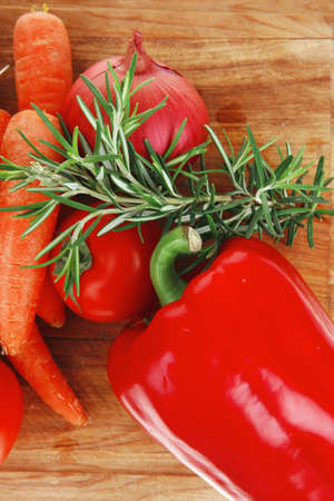 Composition with raw vegetables on kitchen cut board isolated over white backgroundの写真素材