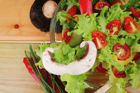 image of vegetables in salad on woodの写真素材