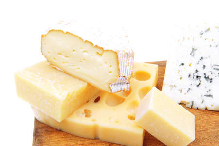 edam parmesan and brie cheese on wooden platter isolated on white background