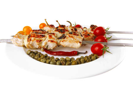 fresh roast pork shish kebab on white platterの写真素材