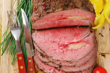 beef barbecue served on big wooden plate