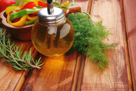 raw peppers sliced on wooden table with sour creamの写真素材