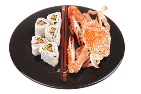Roll with Cucumber , Cream Cheese with raw Tuna and Salmon inside. on black dish with boiled crab . Japanese traditional Cuisineの写真素材