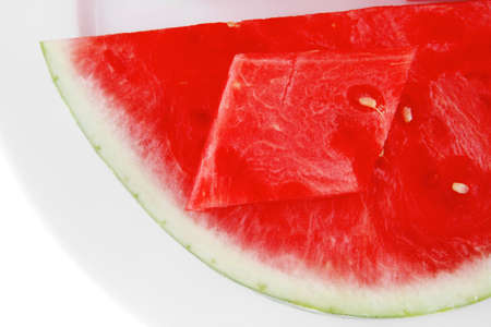 red raw watermelon pieces on white plateのeditorial素材