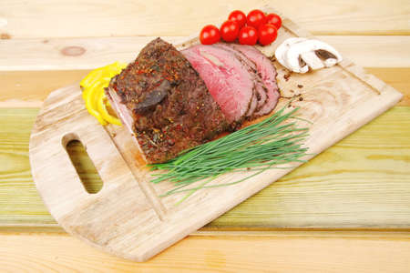 beef barbecue served on big wooden plateのeditorial素材