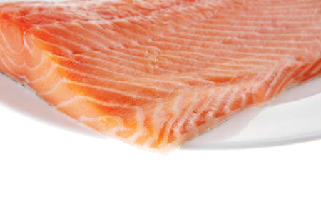 raw salmon fillet isolated on white plateのeditorial素材