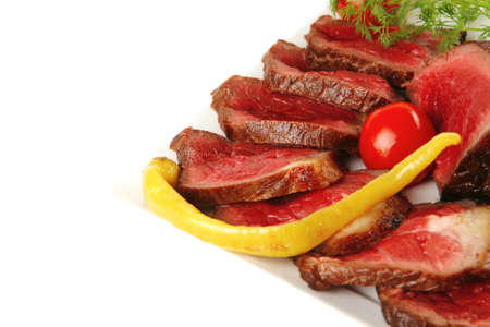 grilled meat chunk and slices on white platesのeditorial素材