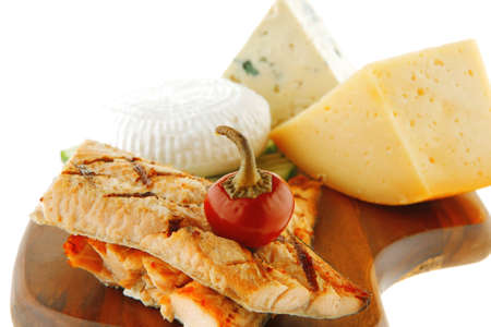 grilled salmon and french cheeses on wooden plateのeditorial素材