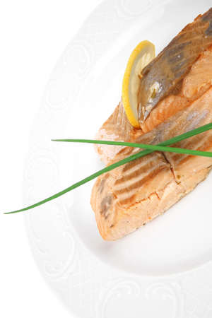 sea food : roasted pink salmon fillet with chinese onion, and lemon on white dish isolated over white backgroundのeditorial素材