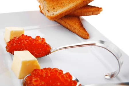 fresh red caviar served on teaspoon on plateの写真素材
