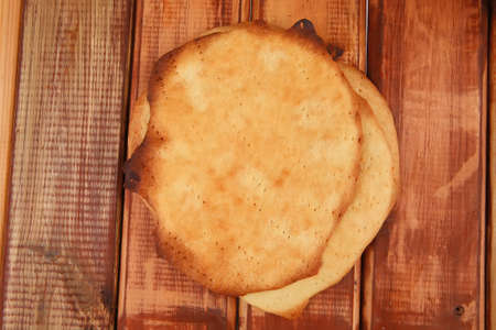big hot baked cakes served on wooden plate