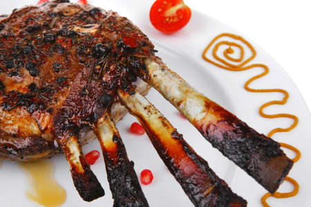 served roast ribs on plate isolated over whiteの写真素材