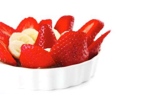 strawberry fruit salad isolated on white plateの写真素材