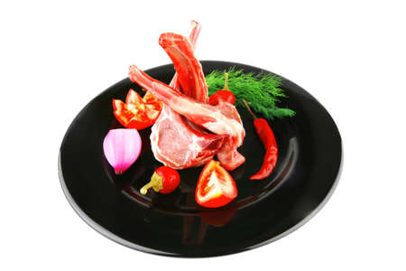 uncooked raw lamb ribs served on plate