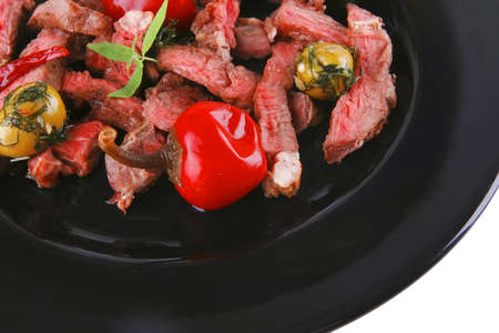 served meat beef slices on black dishの写真素材