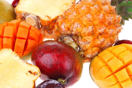 exotic diet food - set of lot of tropical fruits include pineapple mango and red plum isolated over...