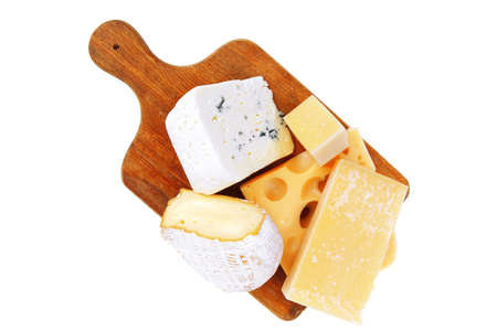 solid french cheese parmesan brie and edam on wooden platter isolated on white background