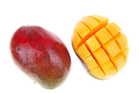fresh raw carved mango isolated over white backgroundの写真素材
