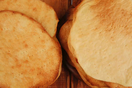 big hot baked cakes served on wooden plate