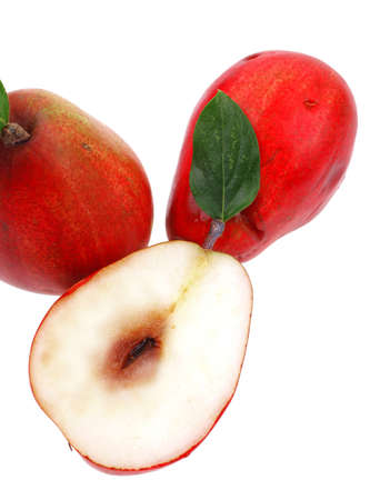group of red pears with half isolated over white backgroundの写真素材