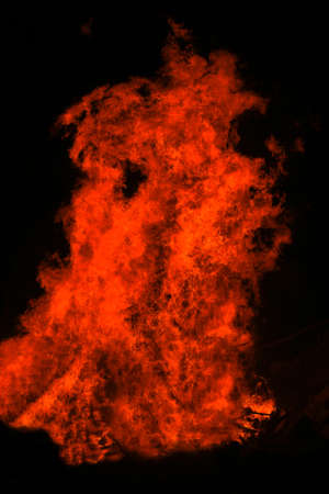 red fire tongue on black backgroundの写真素材