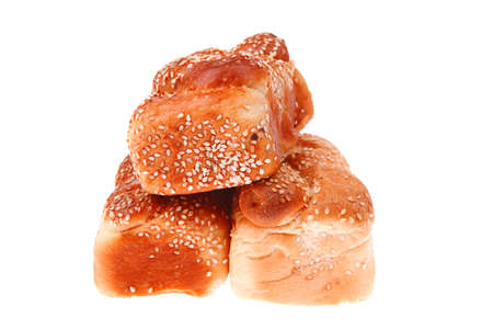 fresh loaf of light wheat bread topped by sesame seeds isolated over white backgroundの写真素材