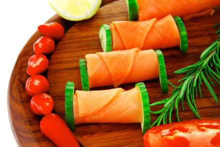 image of smoked salmon slices on dark woodの写真素材