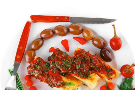 cannelloni in yellow cheese served with pepper and tomatoの写真素材